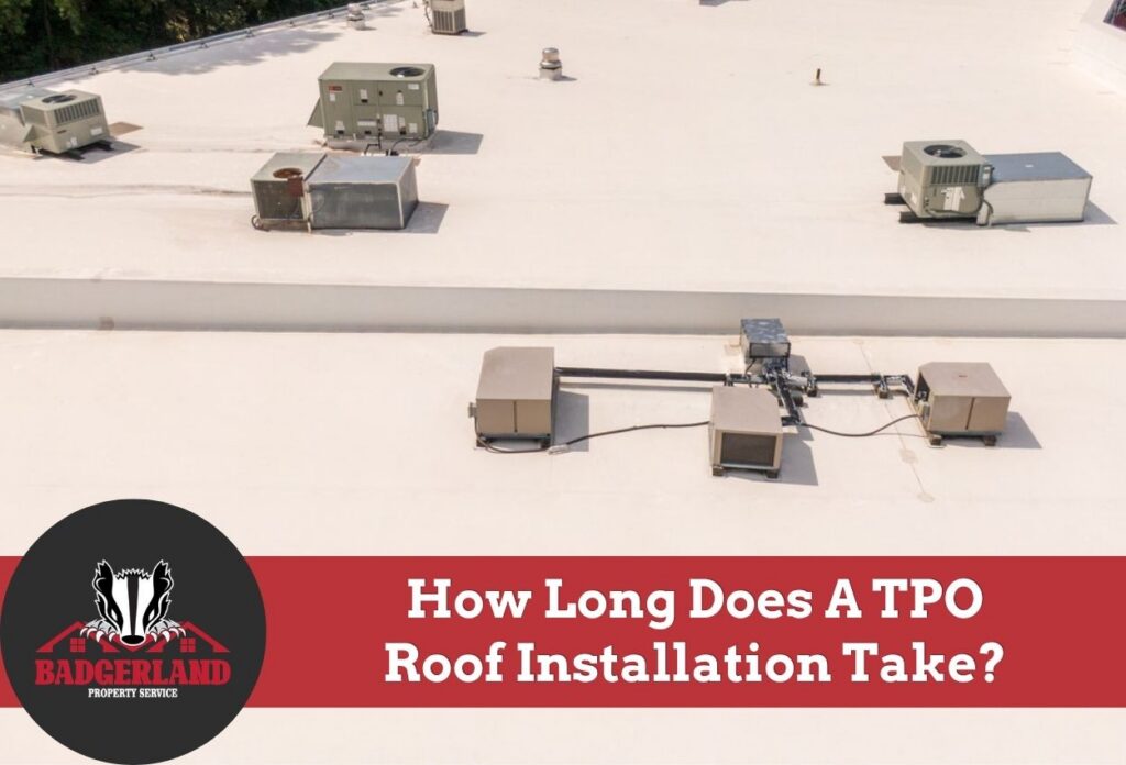 Commercial building rooftop with HVAC systems and TPO roofing.